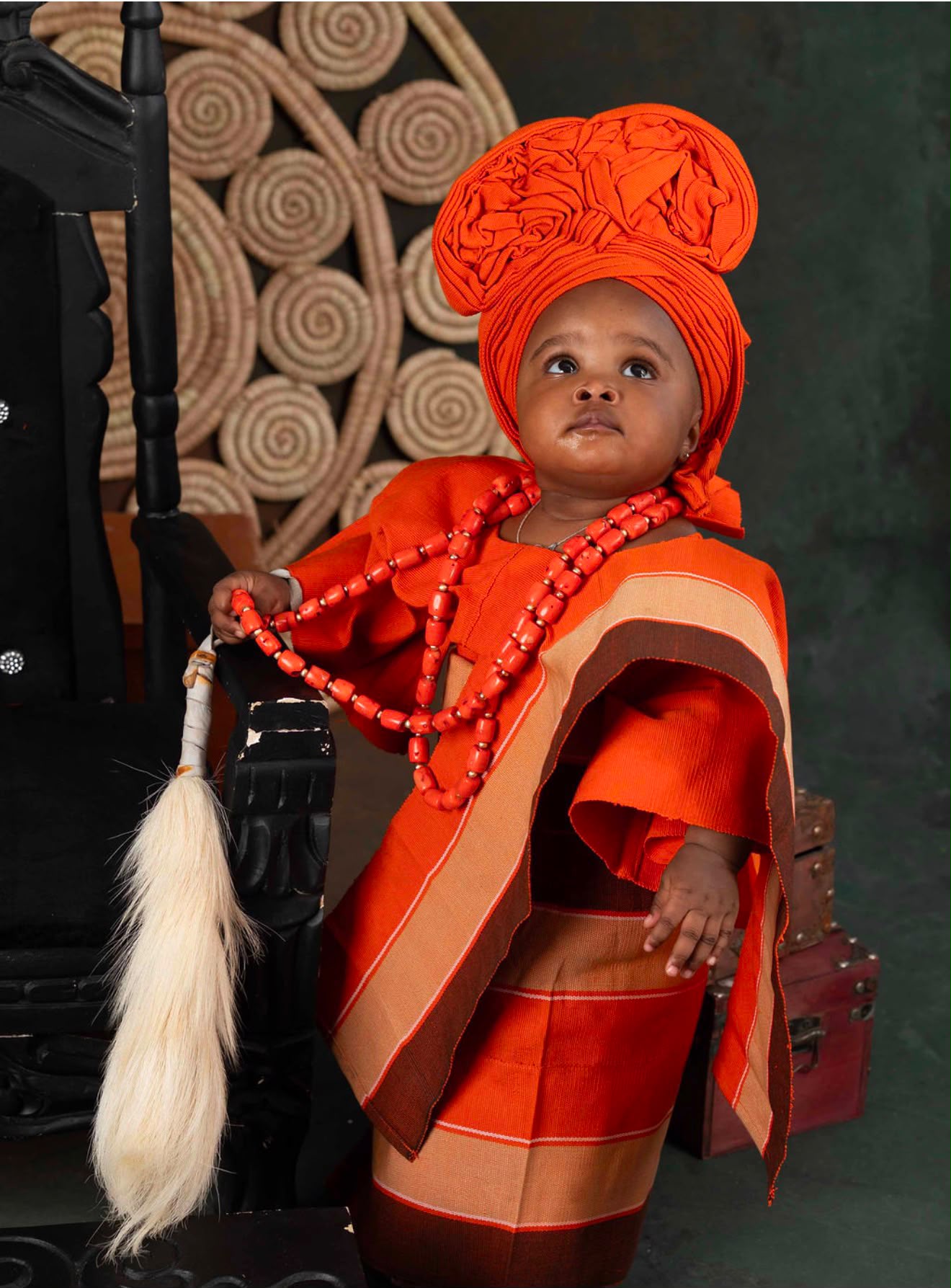 Young girl in purple and gold Aso Oke with small gele