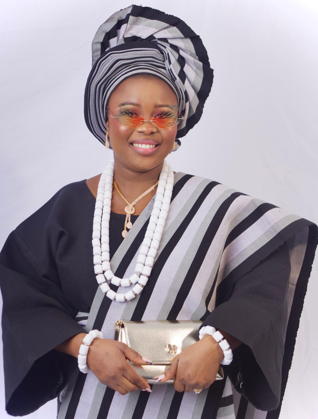 Beautiful Esan attire with coral bead headpiece