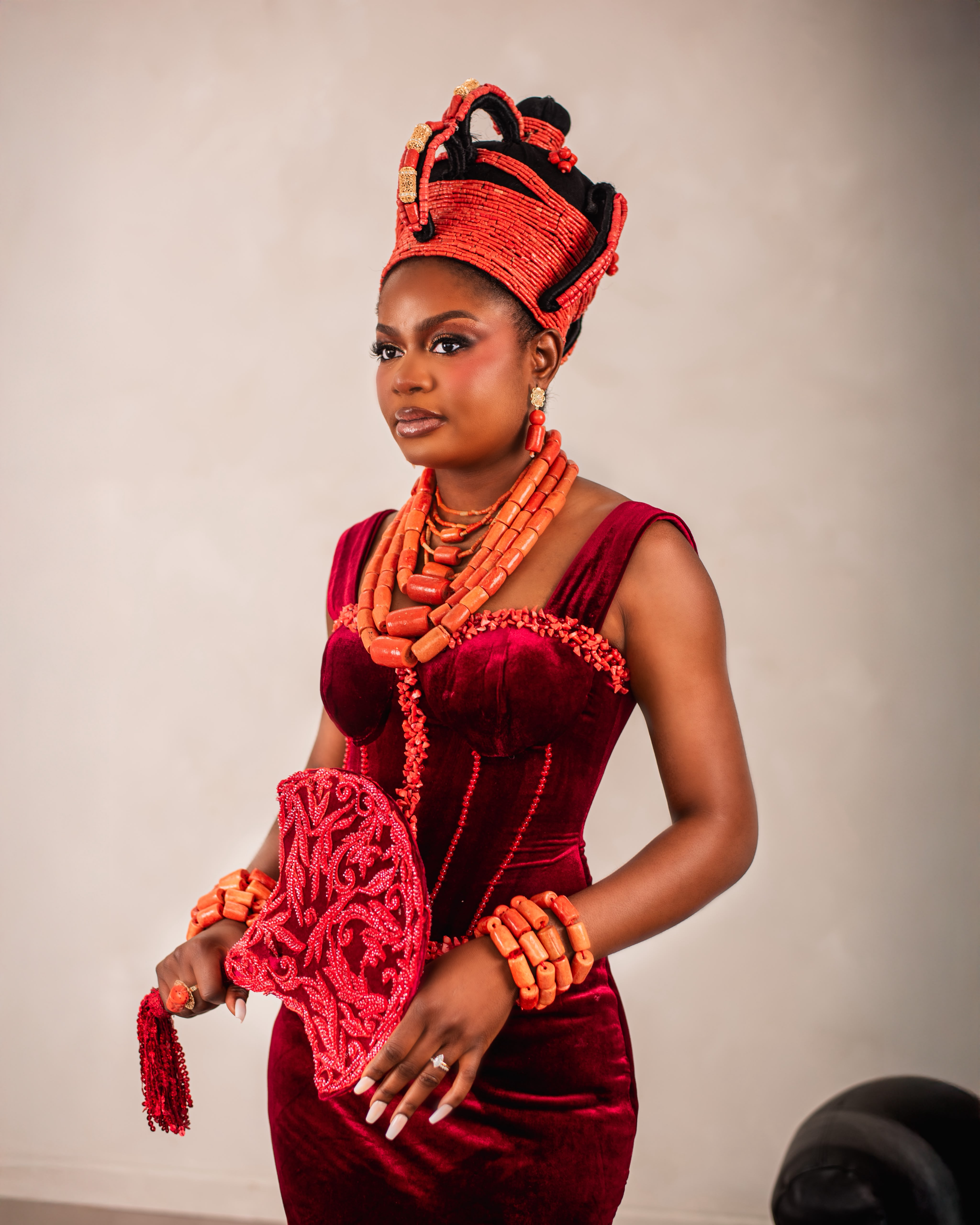 Edo bride in coral bead crown and purple attire