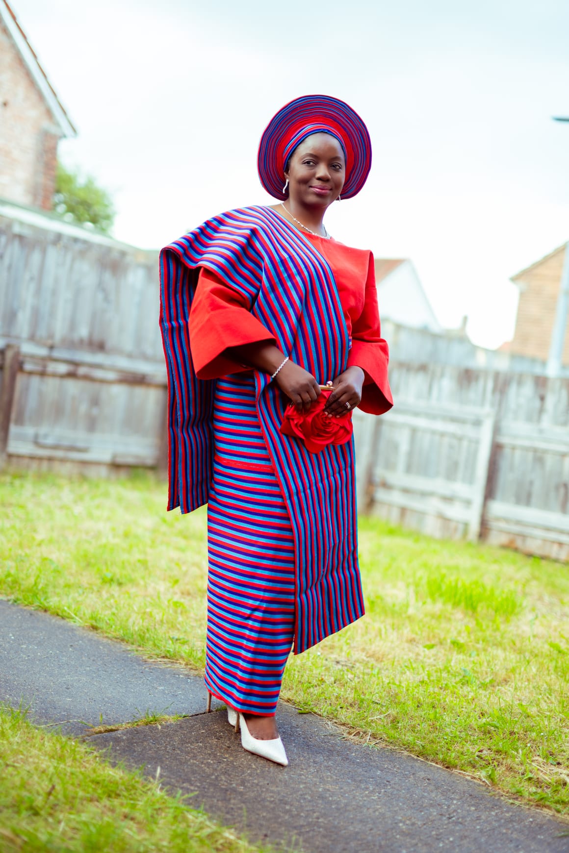 couple in embroidered agbada with fila cap