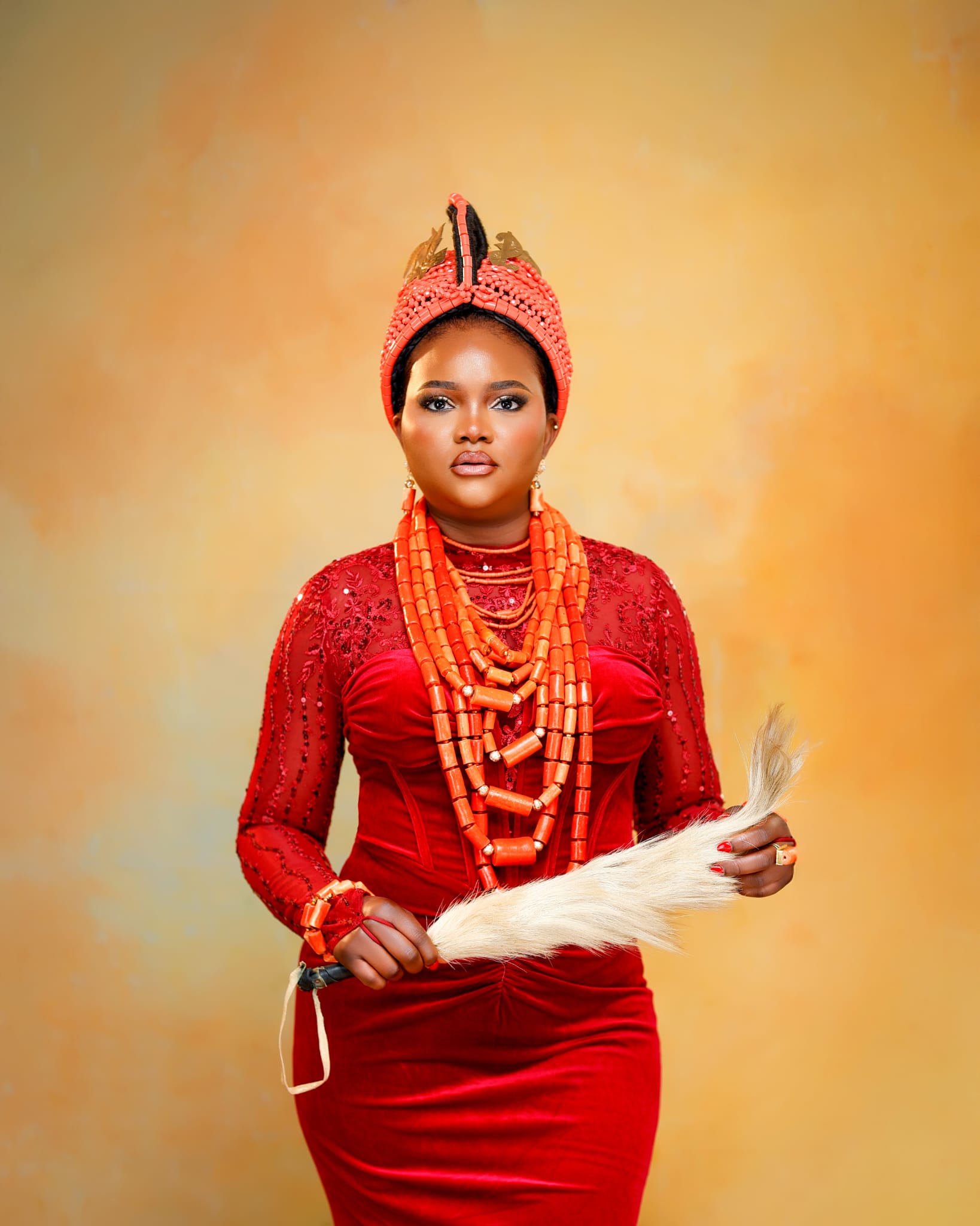 Edo bride in coral bead crown and purple attire